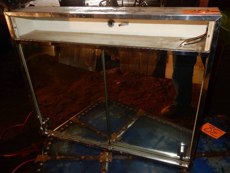 lot 39 image: Vintage metal veneer medicine cabinet w sliding mirror doors and original glass shelves