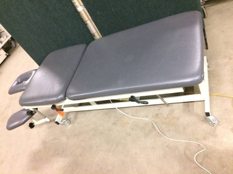 lot 103 image: WOW Retails Used $1800 Excellent Condition Chattanooga Triton Physical Therapy Rehab 3 Section Drop Head Traction Motorized HiLow Treatment Table Chiropractic Massage Spa Tattoo Ink Bed