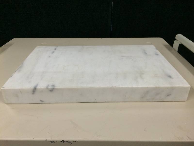 lot 38 image: Granite Sample Cutting Block for Medical Use.