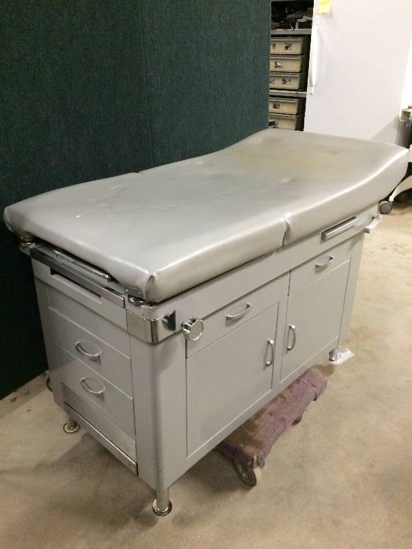 lot 73 image: Awesome  Multi-Use BedExam Table.  Perfect for Tatoos Versatile Postions, Storage and Built in Tool Bowl