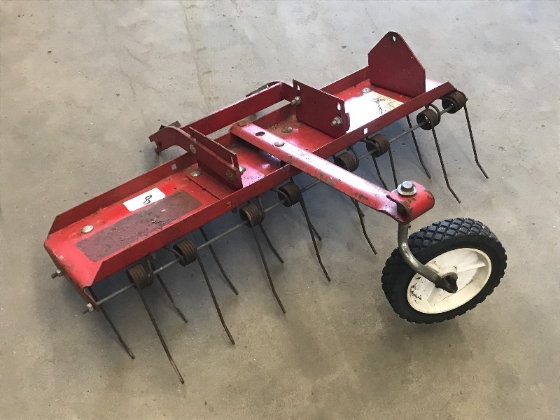 lot 8 image: 21 Lawn Mower De-Thatcher
