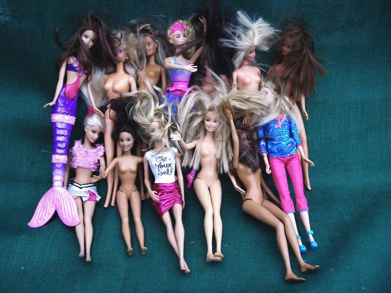 lot 57 image: Barbie doll lot.