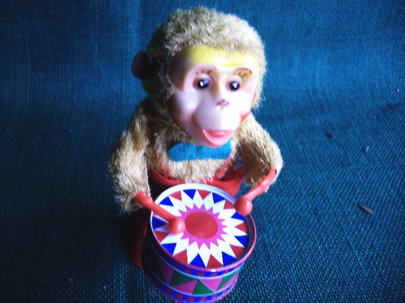 lot 83 image: Antique Mechanical Money drum player.