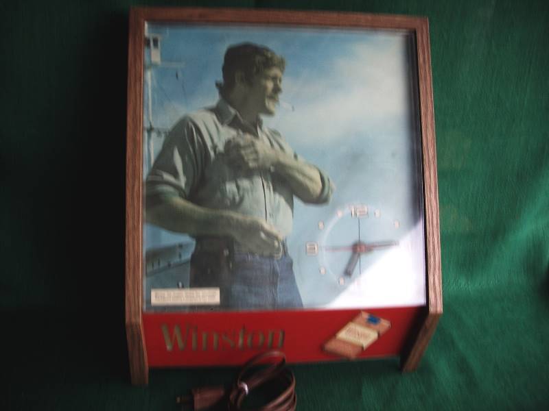 lot 91 image: Vintage Winston Cigarette light up clock.