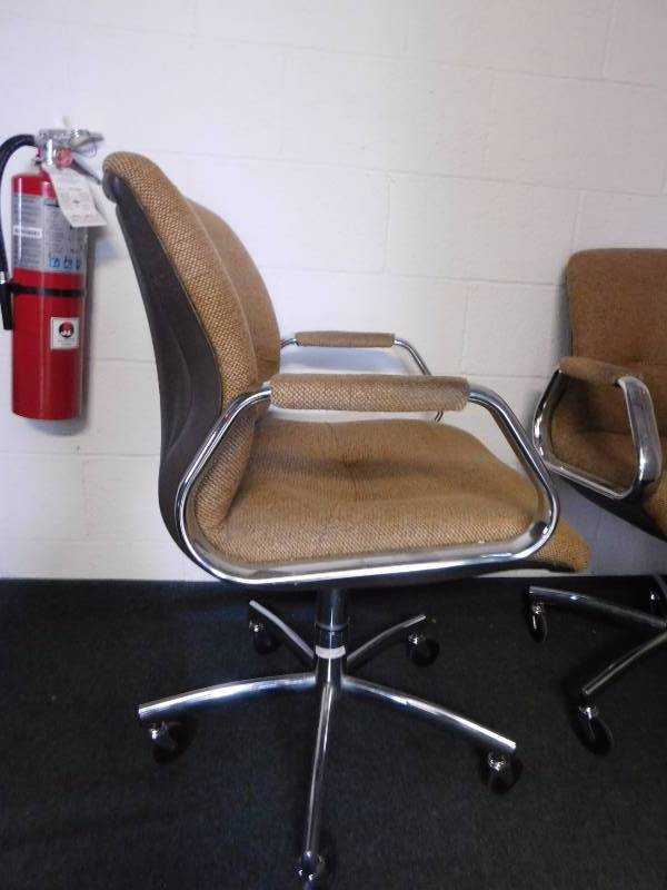 lot 58 image: Two Tan Rolling Office Chairs