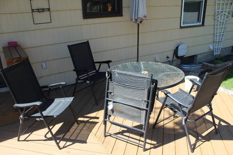 lot 73 image: Glass Top Patio Table w Umbrella, 4-Chairs
