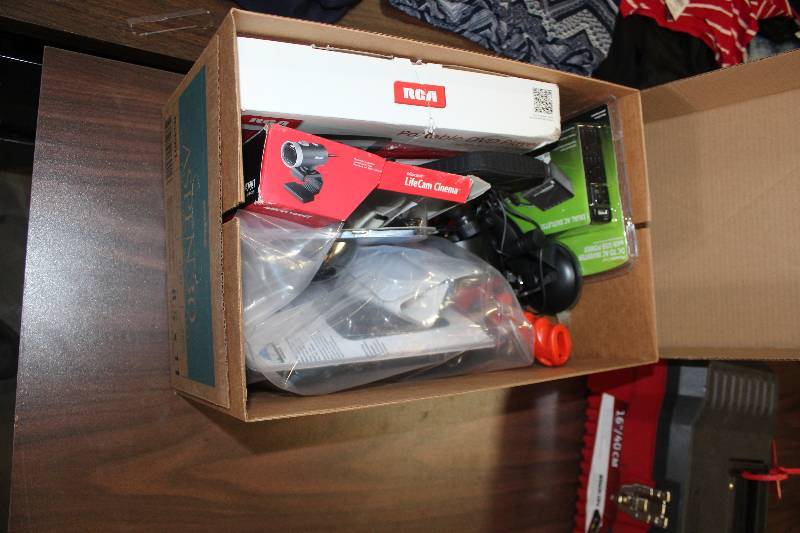 lot 117 image: Electronics Includes 1) Power Line Dual AC Outlet Adapter AND 1) Peak HeaterDefroster AND 1) RCA Portable DVD Player w 9in. LCD Screen AND 1) Black & Decker Rechargeable Flashlight AND 1) Rand McNally GPSRVND AND 1) Onn Optical Mouse