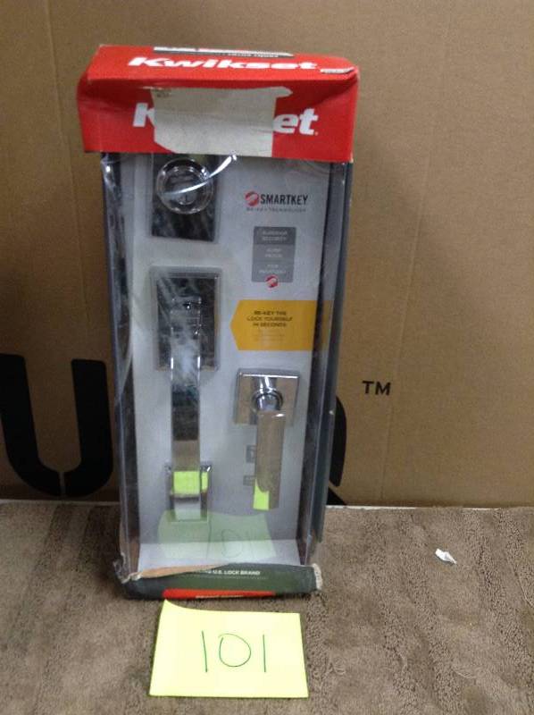 lot 101 image: Kwikset Tavaris Single-Cylinder Polished Chrome Handleset w Vedani Lever  open box never used