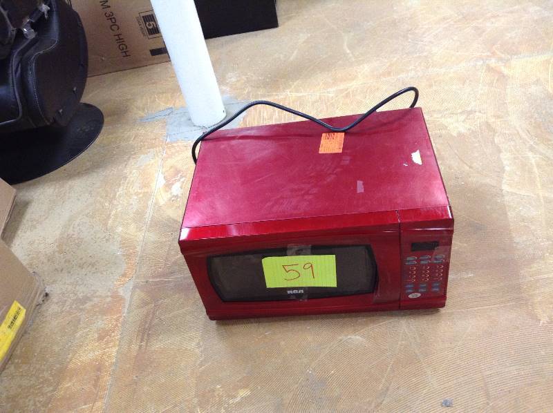 lot 59 image: RCA 1.1 cu. ft. Countertop Microwave in Red in working conditions Model # RMW1112-RED
