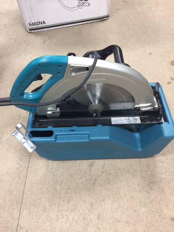 lot 109 image: Makita 15 Amp 16-516 in. Circular Saw Model # 5402NA not used