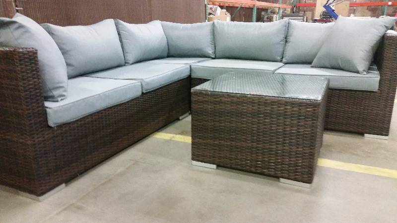 lot 101 image: Minnetonka 4 piece outdoor patio set (sectional is three pieces and table makes fourth)