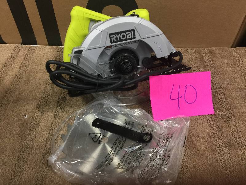 lot 40 image: Ryobi 13-Amp 7-14 in. Circular Saw Model#  CSB125  open box never used