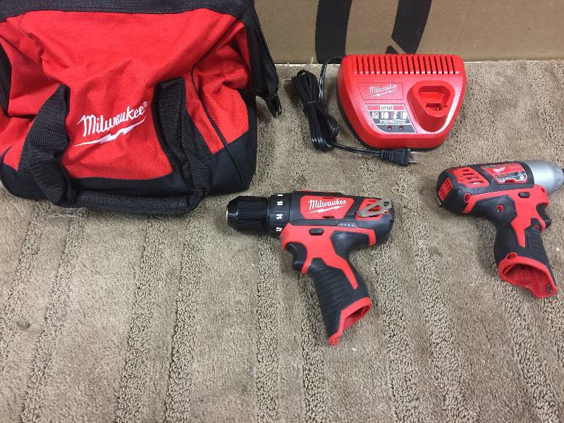 lot 59 image: Milwaukee M12 12-Volt Lithium-Ion Cordless Drill DriverImpact Driver (2-Tool and charger only no used in working conditions