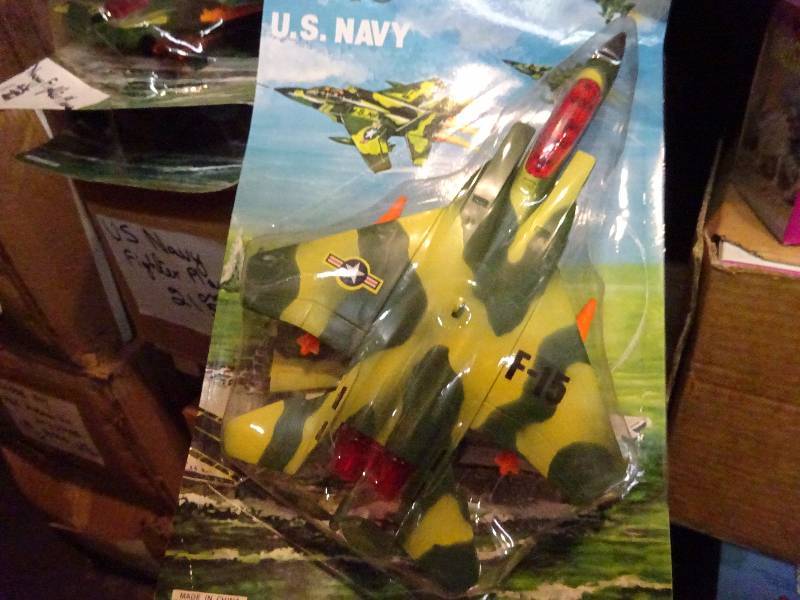 case plus F-15, 2 cases plus wind-up dinosaurs