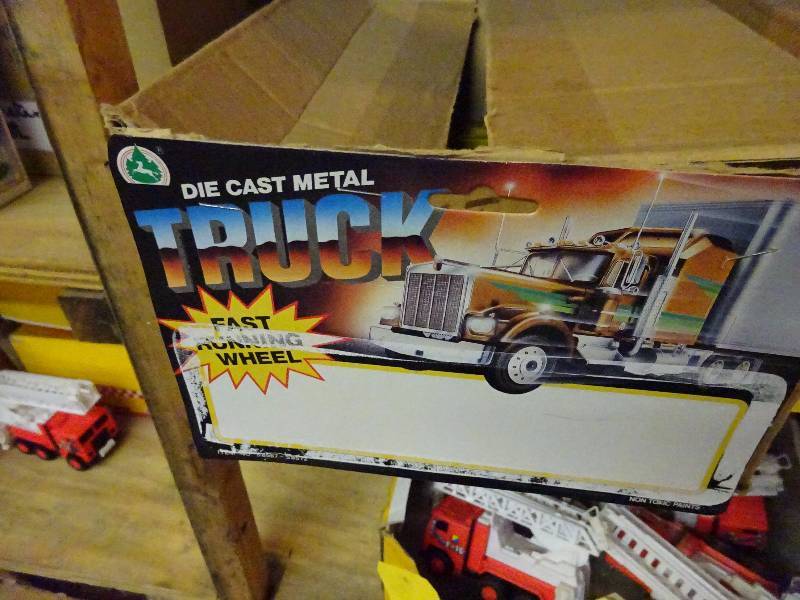 5 cases10dz die cast metal trucks, 9 basketball games, case telephone helmet banks