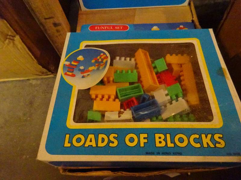 case of blocks, case of IQ games, stickers books, tea sets