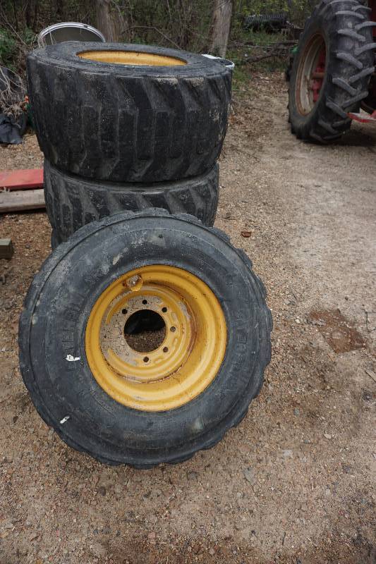 lot 6 image: Set of 4 - Cat Brand Flotation Skid Loader Tires and Rims