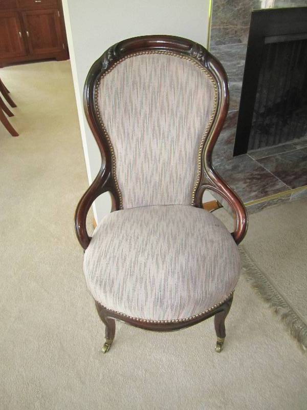 lot 6 image: Antique chair on wheels, has been r...