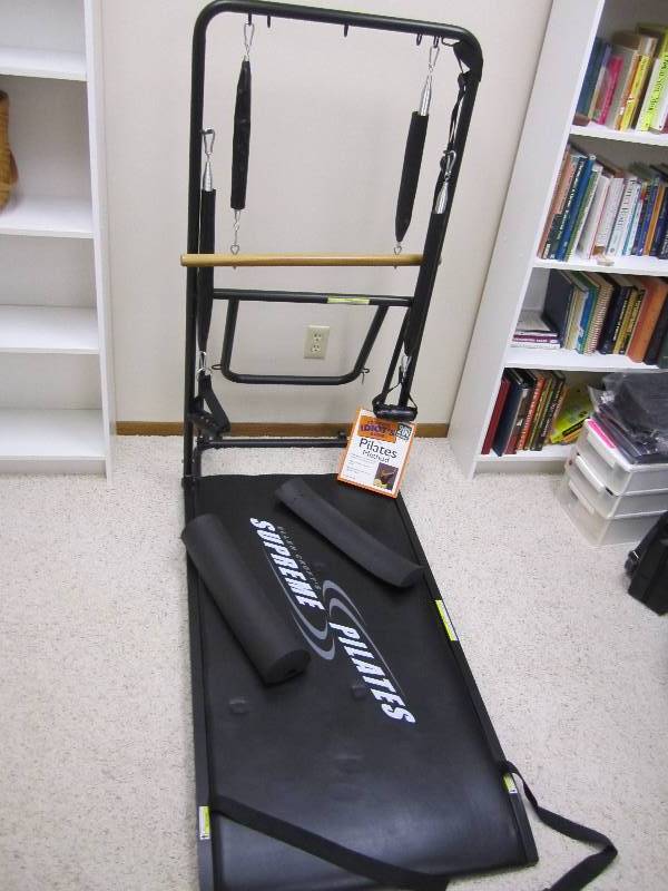 lot 27 image: Fold up Pilates machine with instru...