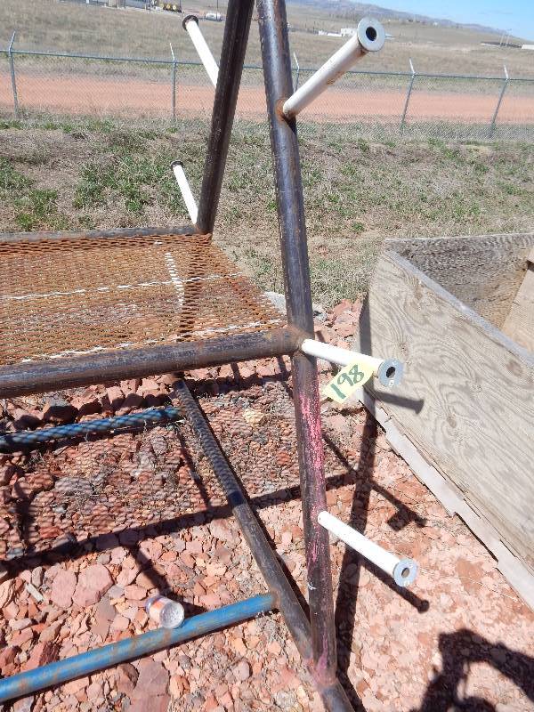 lot 198 image: Steel Rack  with hangers and shelf.