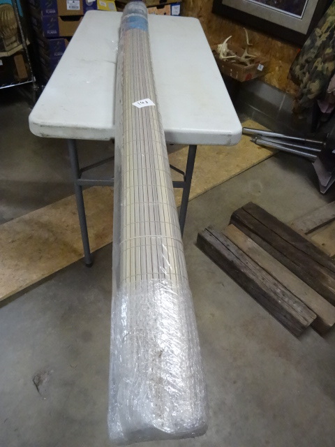 lot 142 image: PVC roll up shade. Wood grain. New....