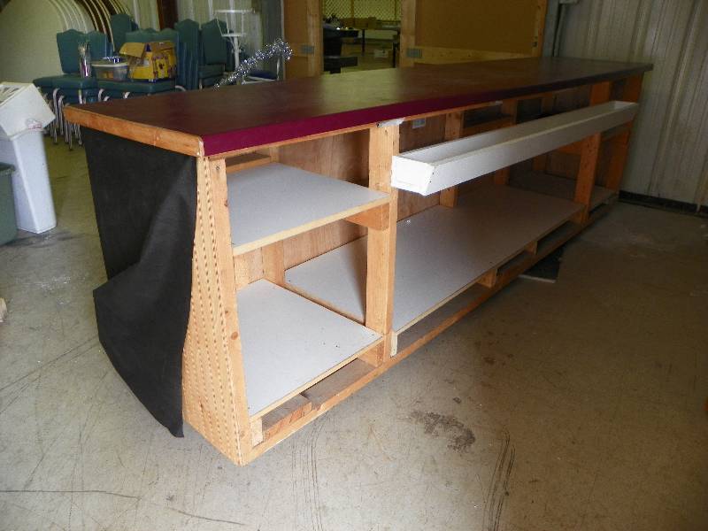 lot 1 image: Portable bar or counter on wheels, laminate top. 124 long x 38.5 tall x 27 deep