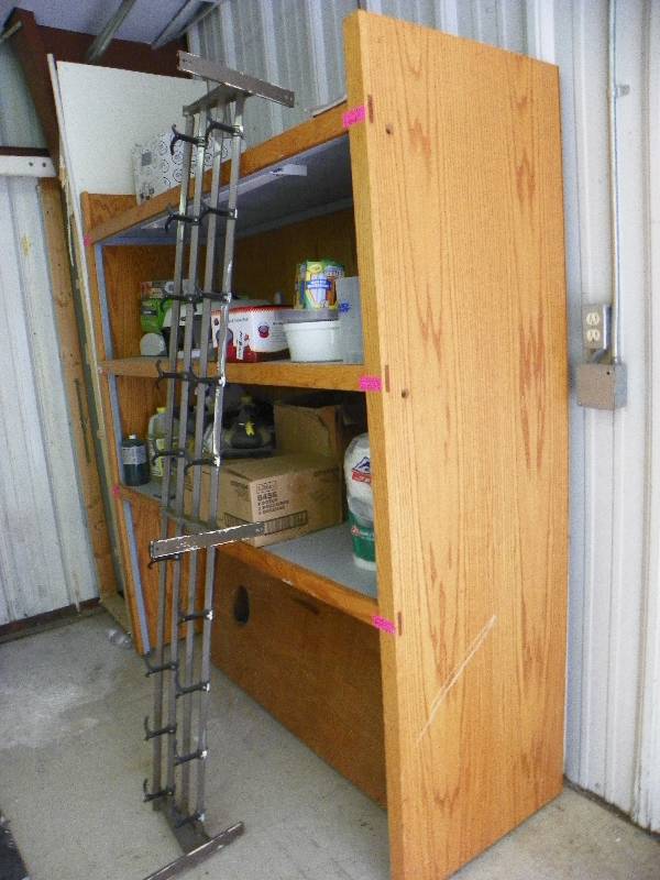 lot 2 image: solid shelving unit, includes all of its contents. 68wide x 77 tall x 24 deep