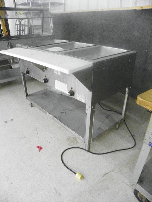 lot 72 image: Food warming station, SUPREMETAL NSF. 47 wide x 33.5 tall x 31 deep (including cutting boards)
