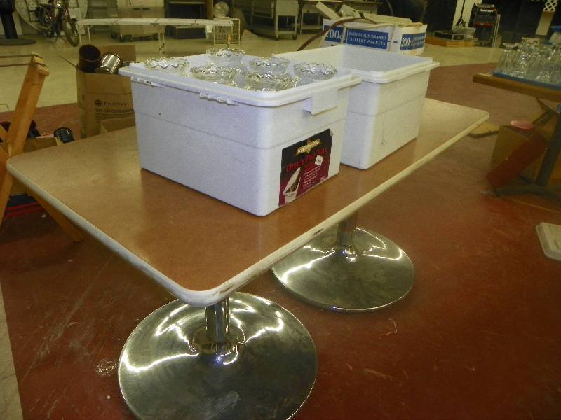 lot 97 image: Table with two pedestal bases, 26 x 59 x 30, includes the contents of boxes on top, bowl vases and cords