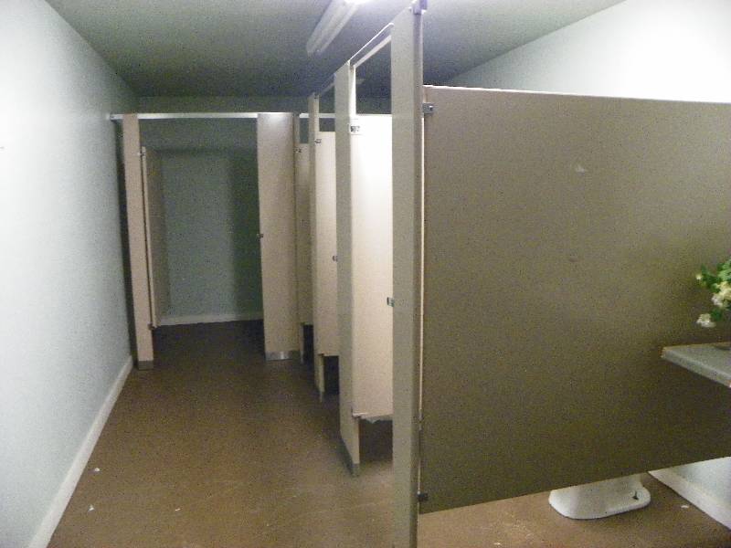 lot 145 image: Bathroom stall dividers, all must be removed