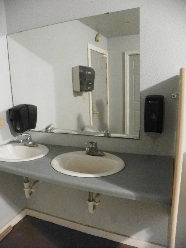 lot 151 image: Bathroom fixtures, mirror, countertop, sinks and faucets and soap dispensers, all must be removed