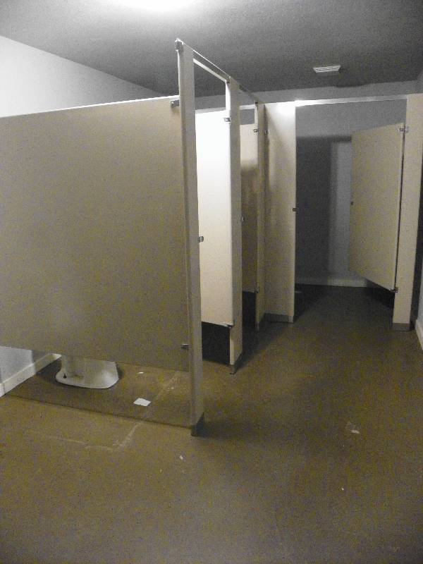 lot 153 image: Bathroom stall dividers, all must be removed