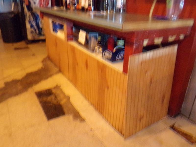 lot 187 image: Shorter back bar with small sink 8 long, 27 deep, 36 tall. DOES NOT INCLUDE and of the liquor.