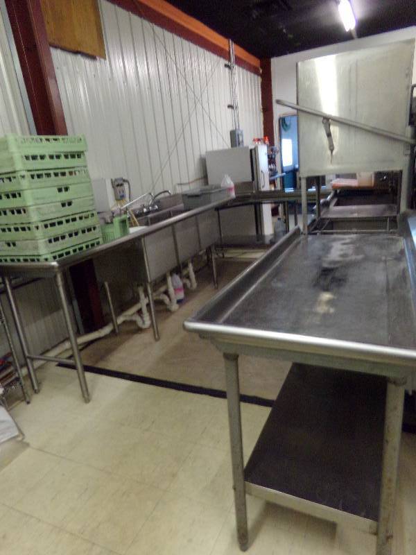 lot 233 image: HOBART Commercial Dishwasher set up, 14 long on side with washer unit, 12 long on sink side.  Will need to be disassembled and removed. Glass and plate racks included