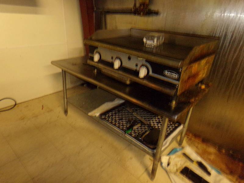 lot 242 image: Grill and Tablestand. 5 wide x 29 tall x 30 deep