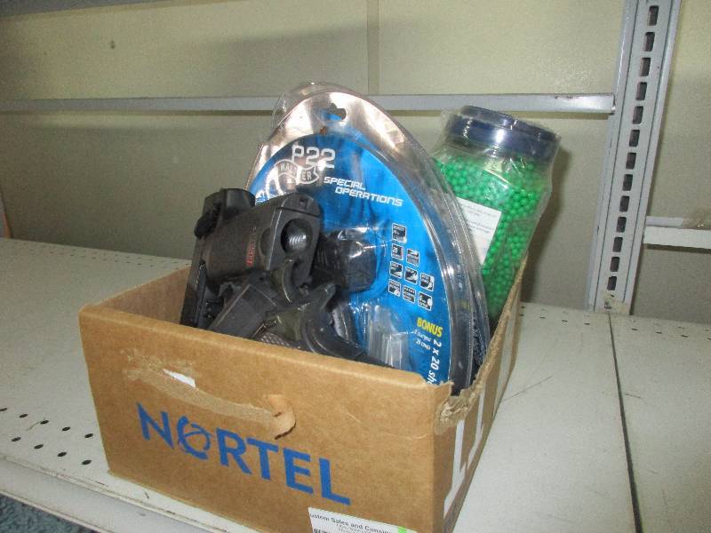6 air soft pistols and 1 container of BBs