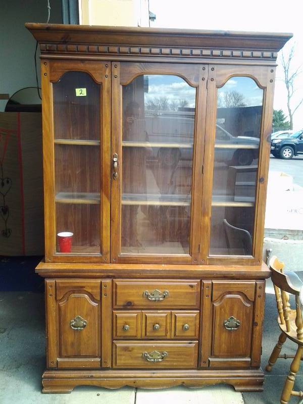 lot 3 image: 2 Piece Wood Hutch 50x16x78. 1-Glass Door Top Section, 2-Door & 3-Door Lower Section.