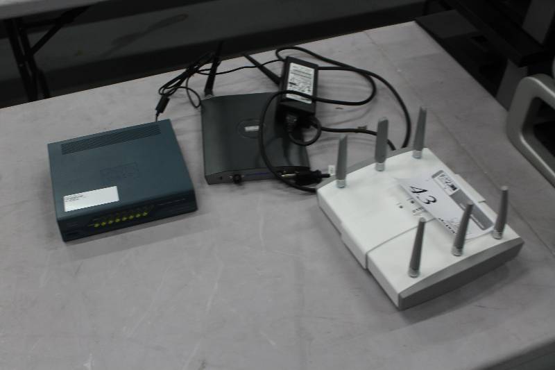 lot 43 image: Lot of (3) Electronics Includes 1) Cisco Aironet IOS Access Point AND 1) Cisco 100MBPS 2100 Series Wireless LAN Controller AND 1) Cisco Aironet 802.11abg 54MBPS Access Point