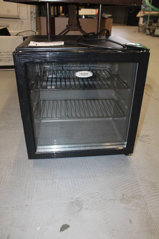 lot 1 image: Haier 61-Can Glass-Door Beverage Center