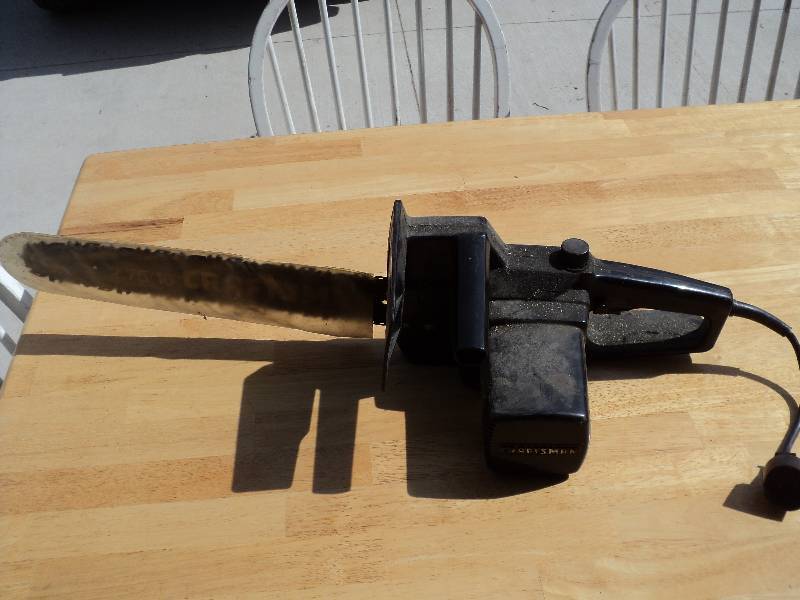 lot 44 image: craftsman electric chainsaw...