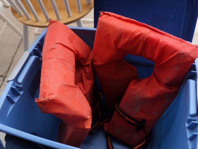 lot 69 image: tote full of life vests and throwab...