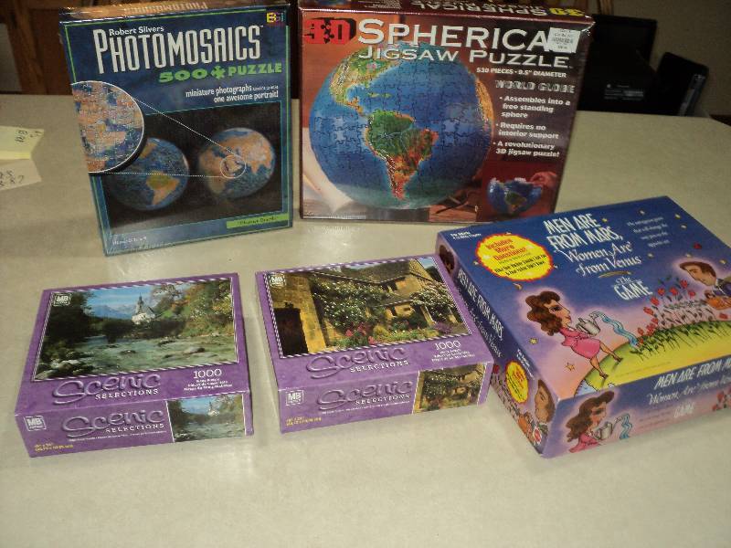 lot 87 image: box of puzzles plus 1 game, some ne...