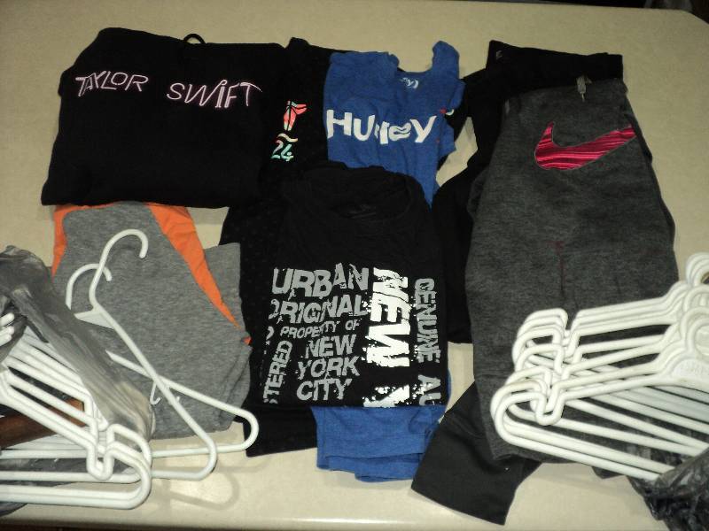 lot 113 image: teen clothing with hangers...