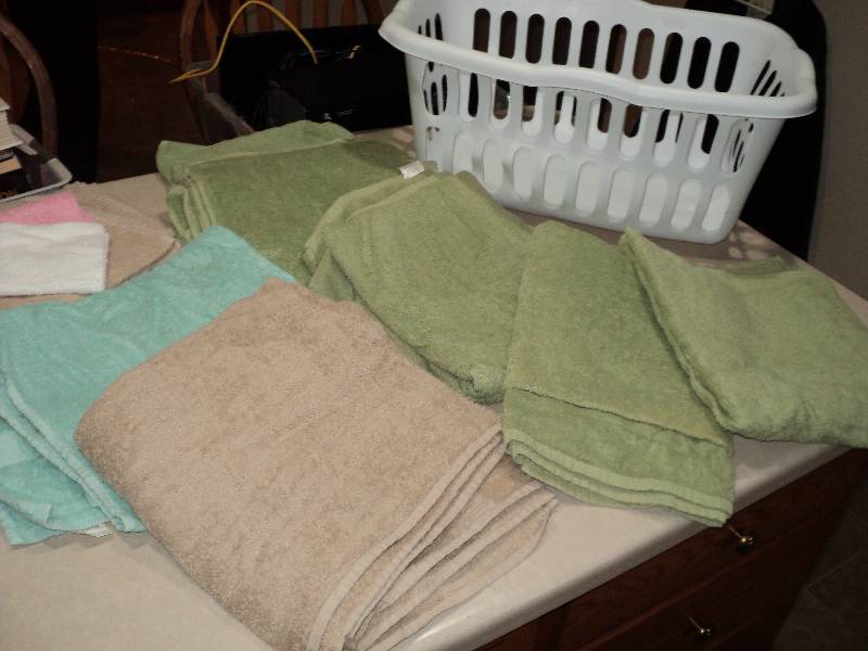 lot 124 image: laundry basket full of towels...