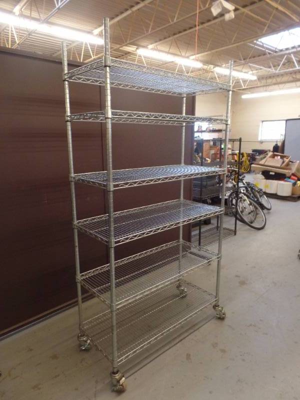 lot 604 image: STAINLESS STEEL ROLLING METRO STYLE SHELVING