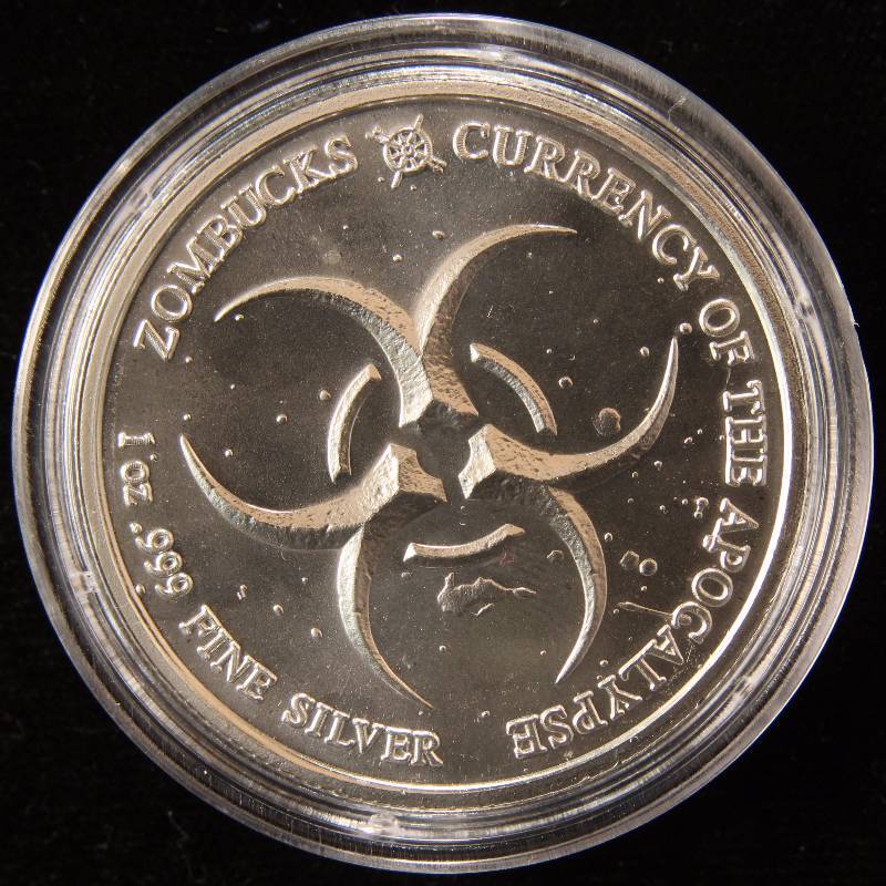 1 TROY OZ. .999 FINE SILVER ZOMBUCKS THE SAINT IN AIRTITE HOLDER