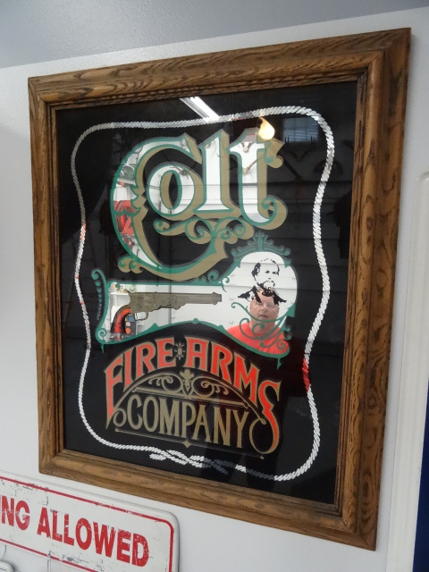 lot 72 image: Colt firearms company wall mount fr...
