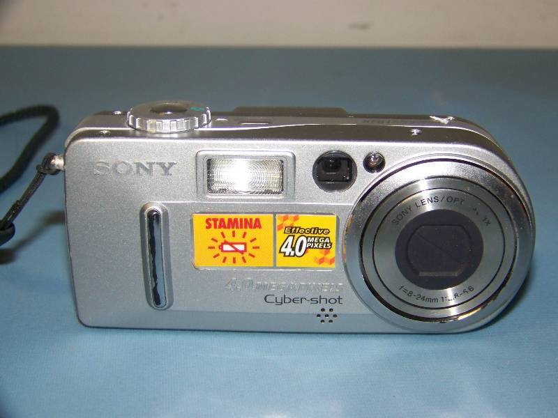 lot 148 image: (1) Sony and (1) Canon, Digital Still Cameras