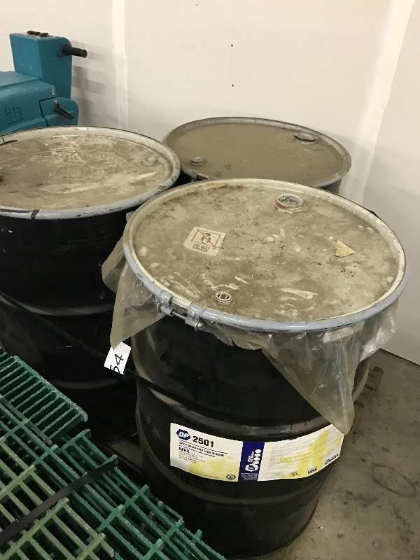 3 drums of adhesive