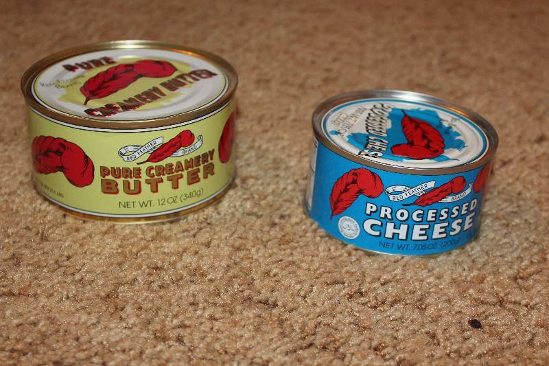 lot 39 image: Red Feather 12oz. Can Pure Creamery Butter, Processed Cheese